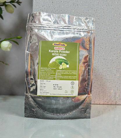 Kerala Kerala Karonda Powder packaging on a reflective surface with flowers in the background