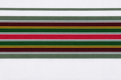 Close-up view of traditional colorful border design on white cotton dhoti fabric