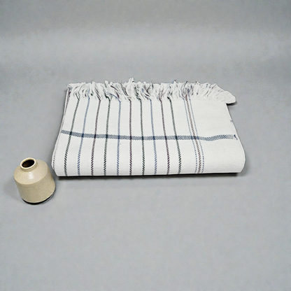 Folded white handwoven khadi cotton khesh blanket