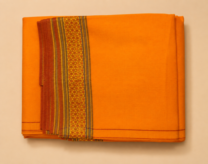 Folded orange cotton dhoti set with traditional woven border and angavastram