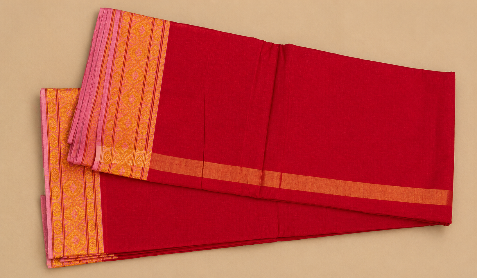 Full view of red cotton dhoti set with golden border and traditional South Indian style design.