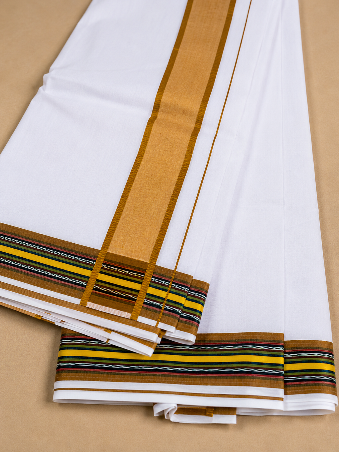 Close up view of white cotton dhoti golden border traditional ethnic fabric design