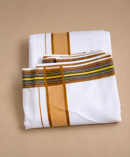 Folded white cotton dhoti set with golden border and angavastram