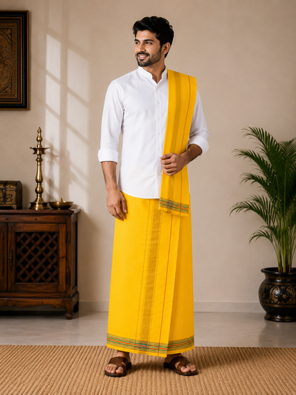 Model wearing premium yellow khadi cotton dhoti with attached gamcha set