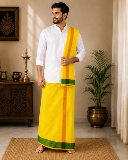 Model wearing premium yellow khadi cotton dhoti with green woven border and attached gamcha
